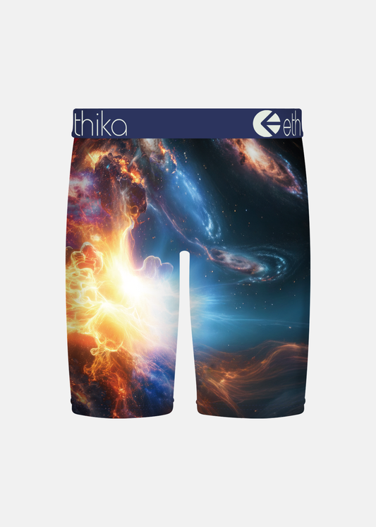 A pair of boxer briefs featuring a vibrant outer-space galaxy print with swirling nebulae in blue, orange, and white. The waistband is navy blue with the brand name 'eth' visible on the right side.