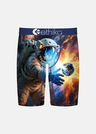 Ethika branded boxer briefs featuring a space-themed graphic print of an astronaut and Earth against a fiery cosmic background, shown on a light gray studio background.