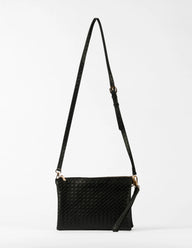 Black woven handbag with a strap on a light gray background
