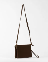 Brown leather crossbody bag with a strap on a white background