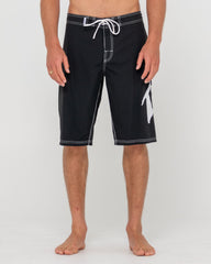 Black shorts with white trim on a plain background