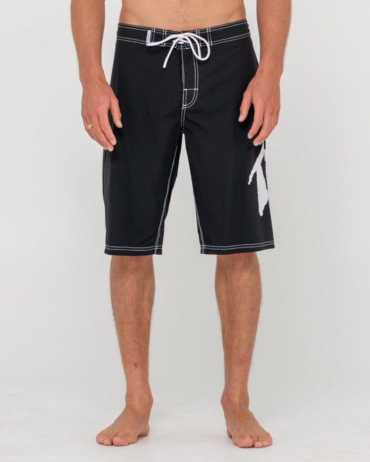 Black shorts with white trim on a plain background