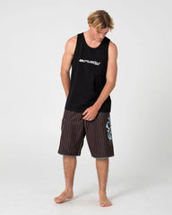 Man wearing a black tank top and striped shorts on a white background