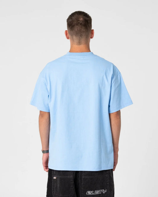 Person wearing a light blue t-shirt on a plain background