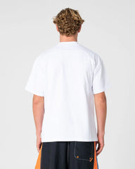 Person wearing a white t-shirt on a plain background
