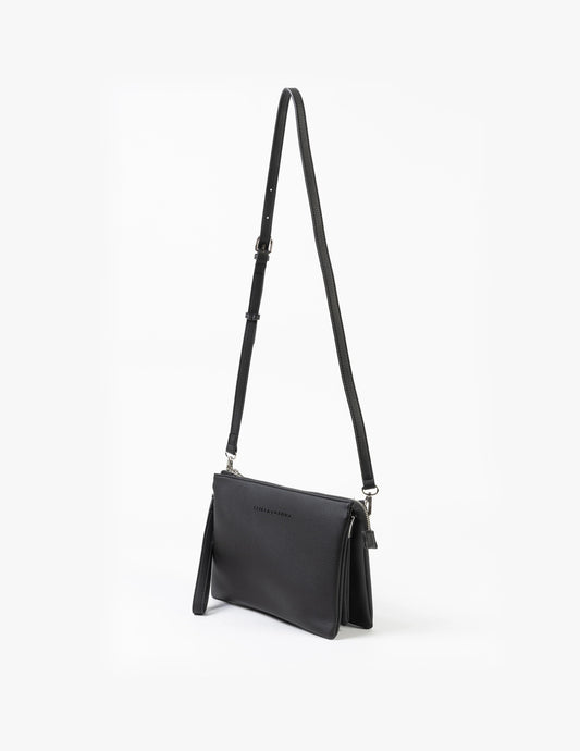 Black crossbody bag with a strap on a white background
