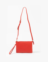 Red crossbody bag on a white background