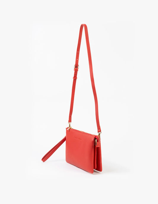 Red crossbody bag on a white background