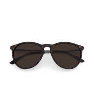 Oversized round sunglasses with dark brown lenses and a glossy dark brown acetate frame, shown from the front on a solid white background.