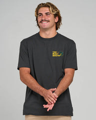 Man wearing a black t-shirt with a logo on a gray background