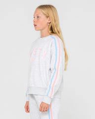 Young girl wearing a light gray sweatshirt with colorful stripes on a white background