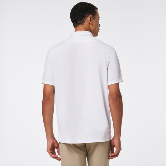 Man wearing a white polo shirt and beige pants on a white background