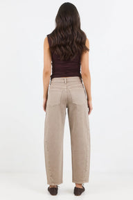 Woman wearing beige pants on a white background