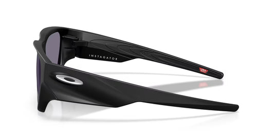 Black sunglasses with 'Instigator' branding on a white background