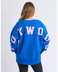 Blue sweatshirt with pink text on a white background