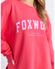 Red sweatshirt with 'FOXWOOD' branding on a white background