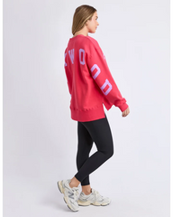 Person wearing a red sweatshirt with 'FOXWOOD' text on the back, standing against a white background