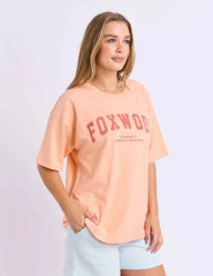 neon peach tee with pink writing and foxwood logo front and back
