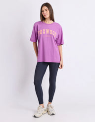 purple tee with orange writing and foxwood logo front and back
