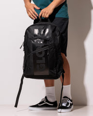 Person wearing a black backpack with 'GLOBE' branding on a plain background