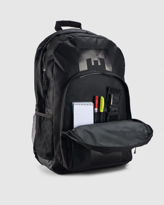 Black backpack with open front pocket on a light gray background