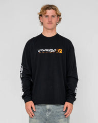 Person wearing a black long-sleeve shirt with a logo on a gray background