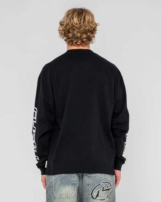 Person wearing a black long-sleeve shirt with branding on a gray background