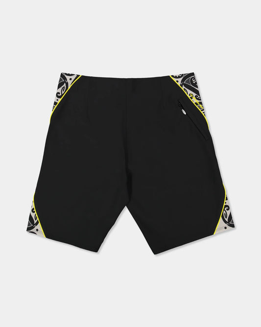 Black boardshort with yellow detail and black and white maori design 