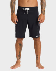 Person wearing black board shorts with white drawstring on a white background