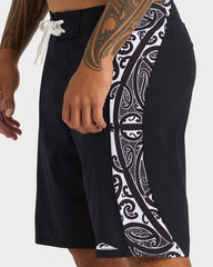Black shorts with white tribal pattern on a white background
