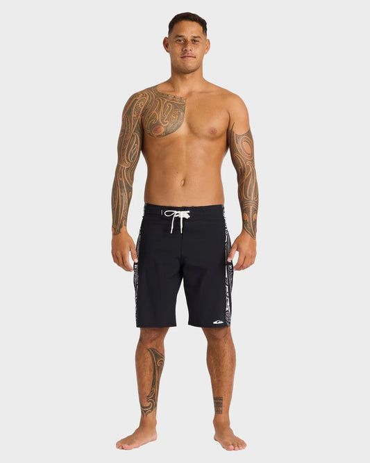 Man wearing black swim shorts on a white background