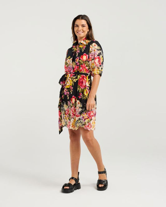 Woman wearing a floral dress on a white background