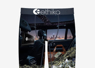 Ethika brand shorts with car interior and money design on a white background
