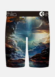 Shorts with a nature-themed design featuring a cross and ethereal landscape, branded with 'ithika' and 'eth'.