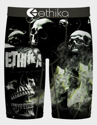 Black underwear with skull design and 'ethika' branding on a white background