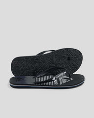 Black and gray sandal with Quiksilver logo on a light gray background