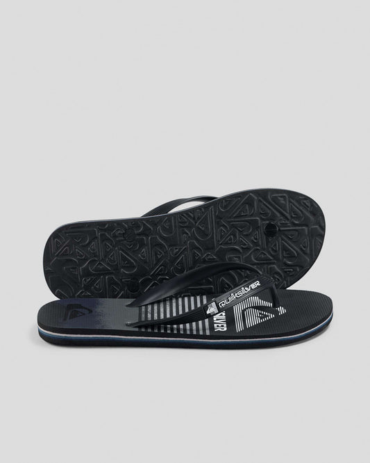 Black and gray sandal with Quiksilver logo on a light gray background