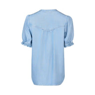 Light blue denim shirt on a white background
