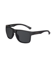 Matte black square sunglasses with dark lenses and a small gold-toned logo on the side temple, shown on a clean white background.