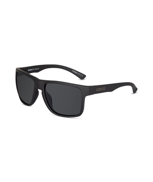 Matte black square sunglasses with dark lenses and a small gold-toned logo on the side temple, shown on a clean white background.
