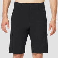 Black cargo shorts worn by a person on a light gray background