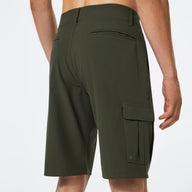Green cargo shorts worn by a person on a white background