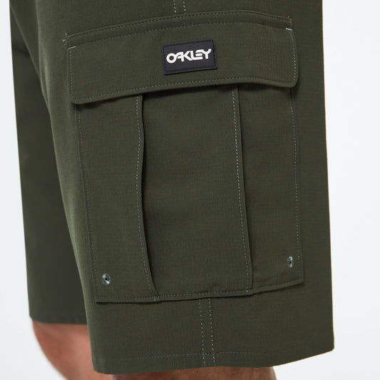 Green cargo shorts with a visible Oakley logo on a white background