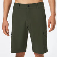 Green cargo shorts worn by a person on a white background