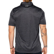 Person wearing a dark gray polo shirt with a visible brand logo on the chest.