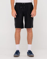 Person wearing black shorts on a white background