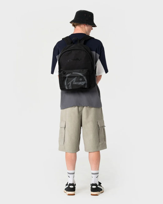 Person wearing a black backpack with a visible brand logo on a white background