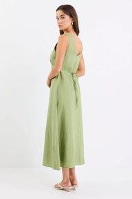 Woman wearing a green dress on a white background