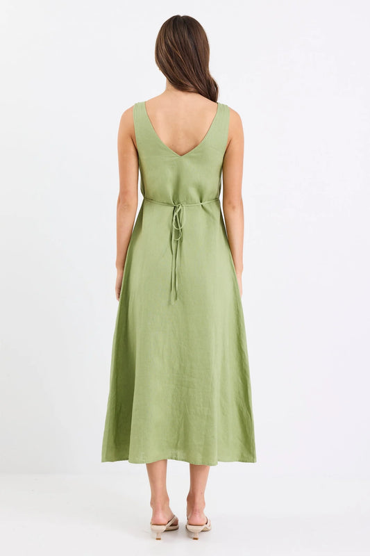 Woman wearing a green dress on a white background