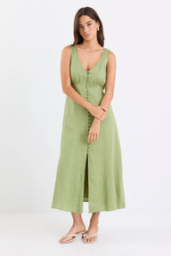 Woman wearing a green dress on a white background